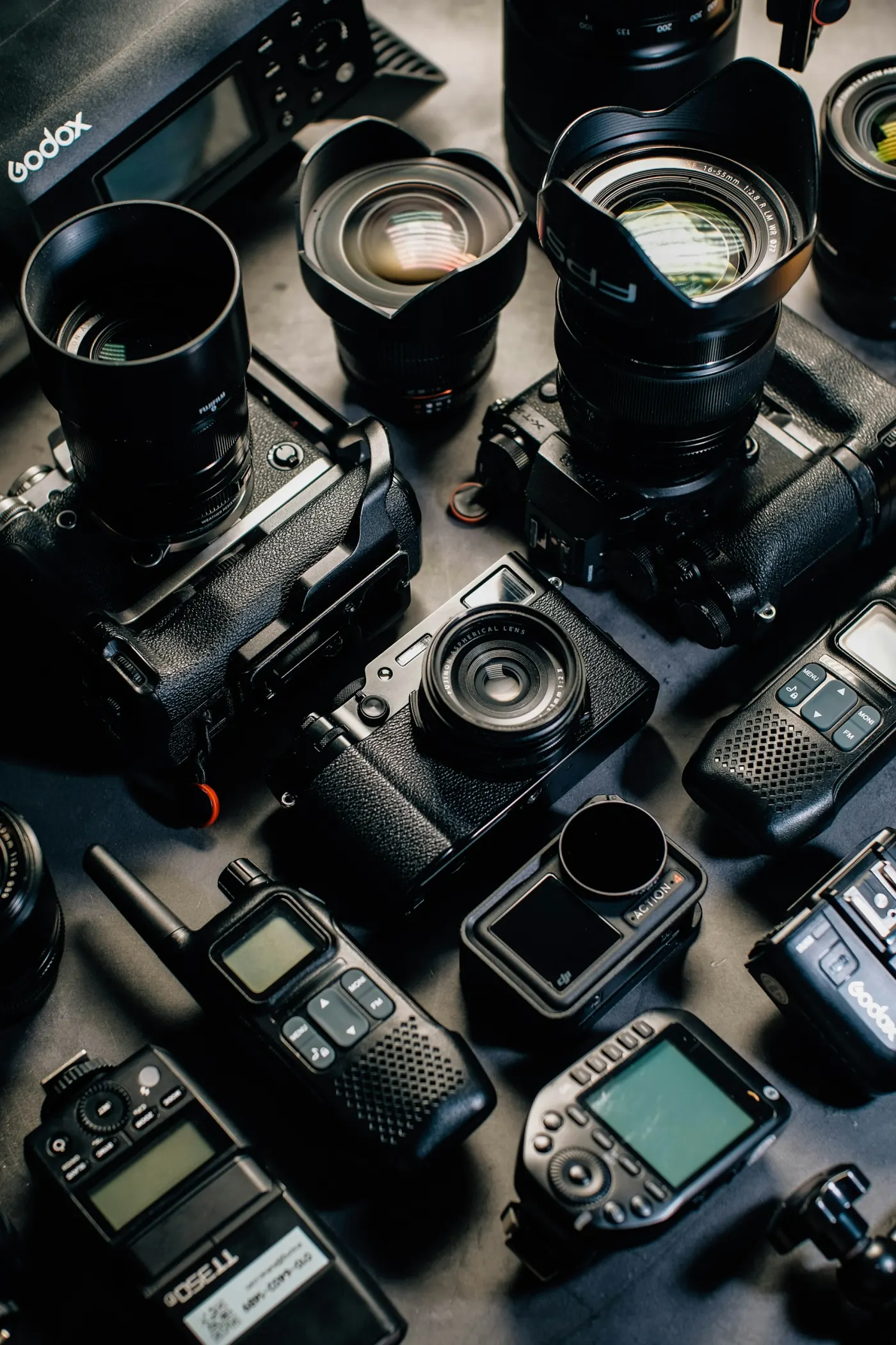 Camera equipment arranged together as a kit.