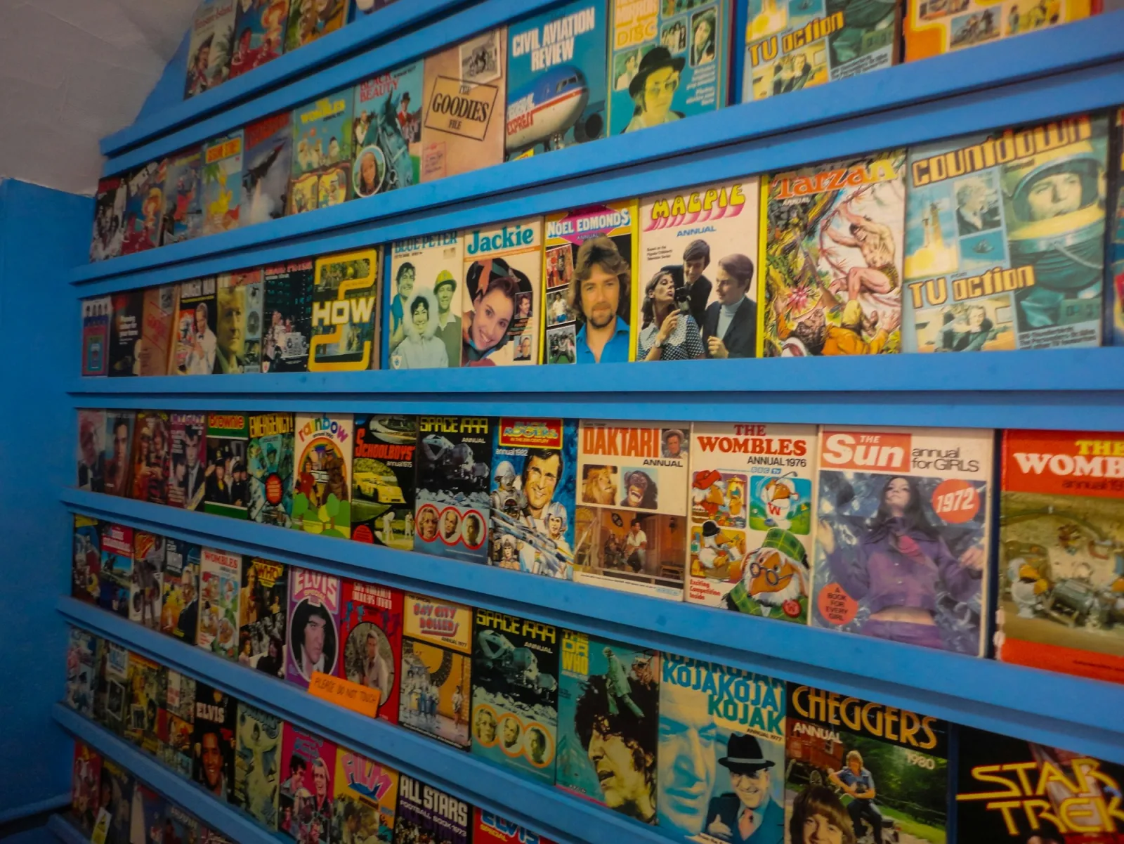Shelves of physical comic books representing a Catalist Comics collection