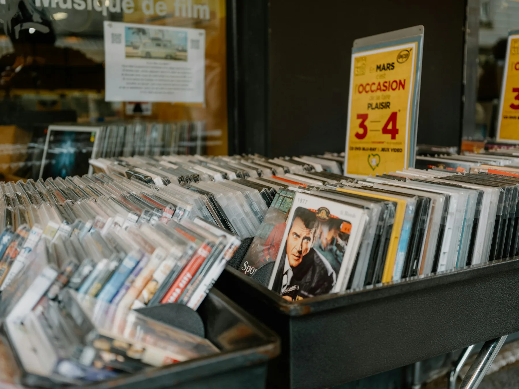 Physical movie releases organized in browsing bins