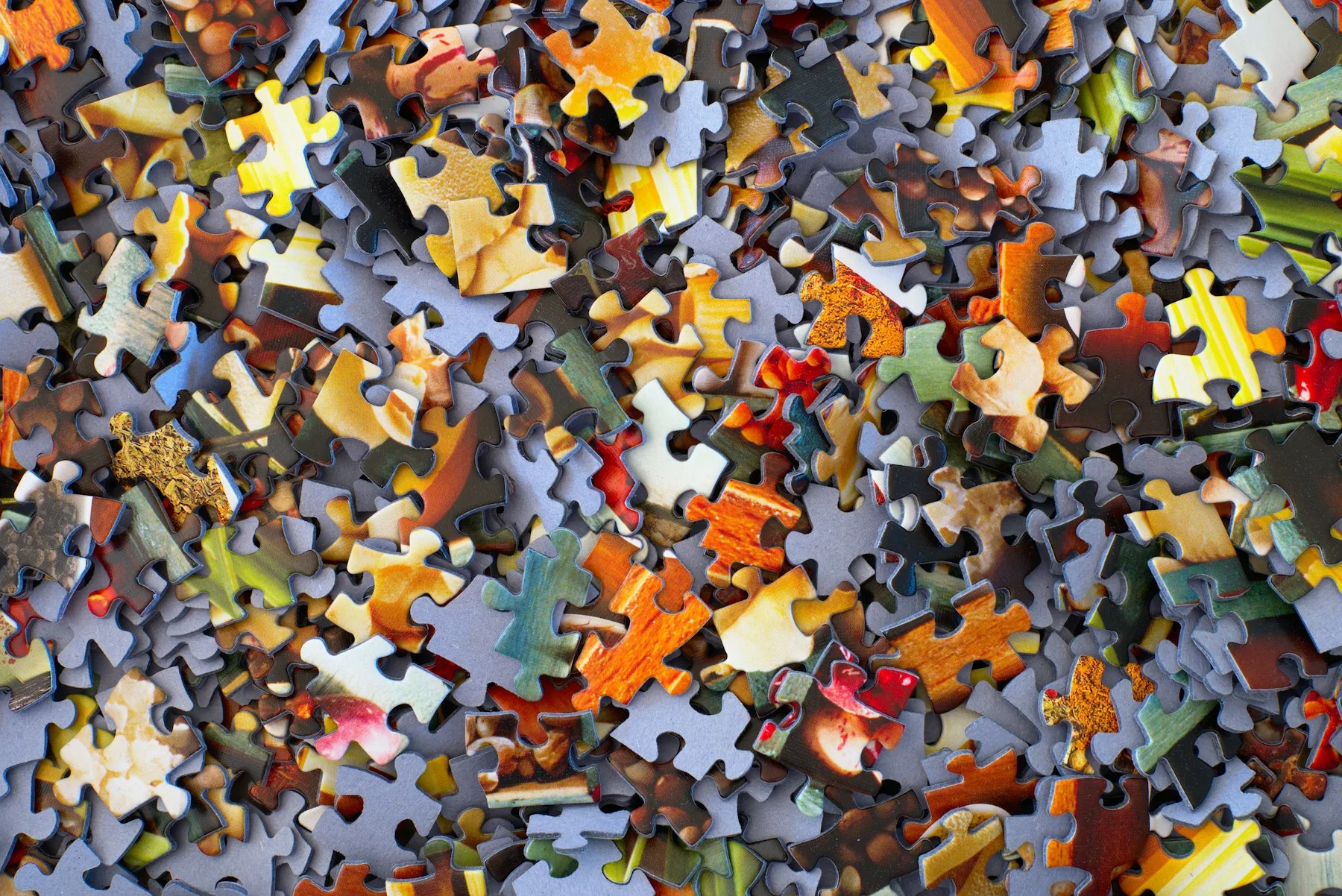 Colorful jigsaw puzzle pieces representing a Catalist Puzzles collection