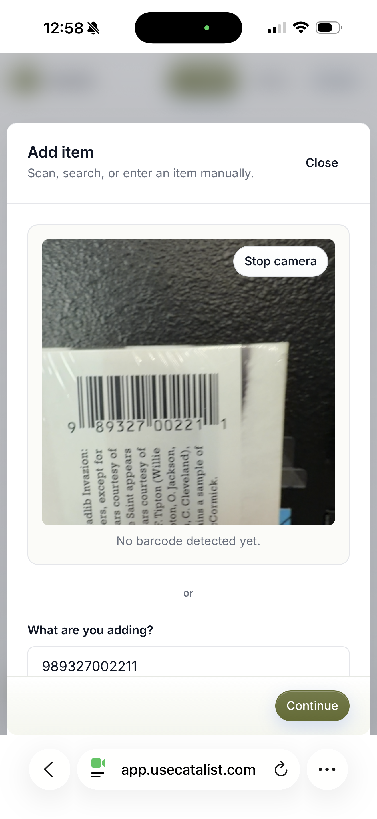 Catalist camera scanner pointed at a supported book barcode.